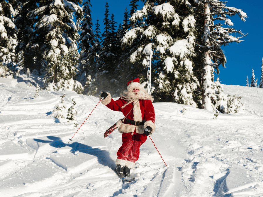 Santa skis down a snowy mountain amidst snow-covered evergreens, bringing a sense of festive fun to the slopes.