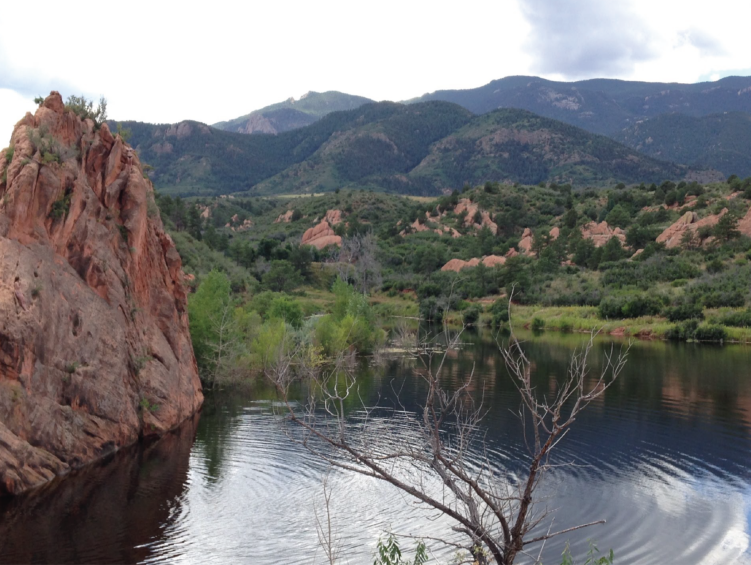 Hikers explore the red rock formations at Red Rock Canyon Open Space, a scenic Denver area destination for outdoor adventure.