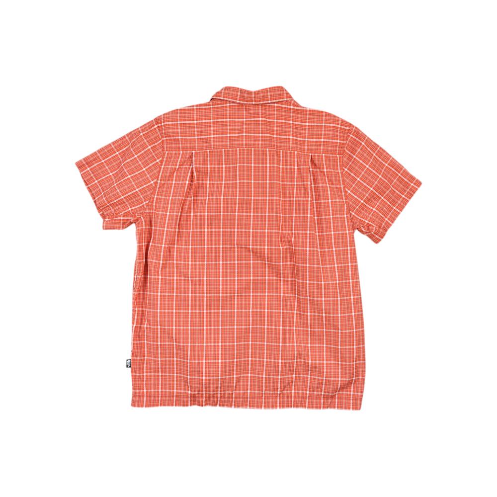 Orange button-down shirt by North Face with a classic plaid pattern on a textured fabric.