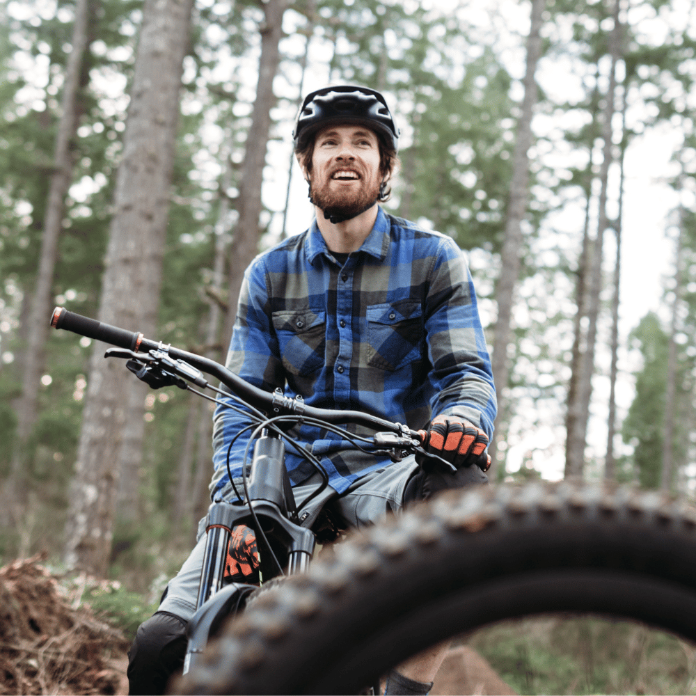 Man riding a mountain bike in a forest