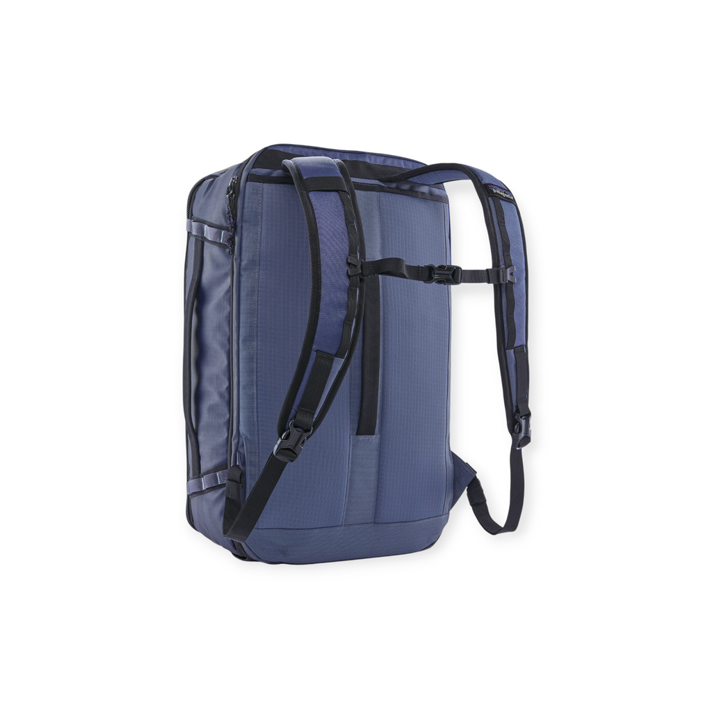 Blue backpack by Patagonia featuring black straps and buckles, presented from the back.