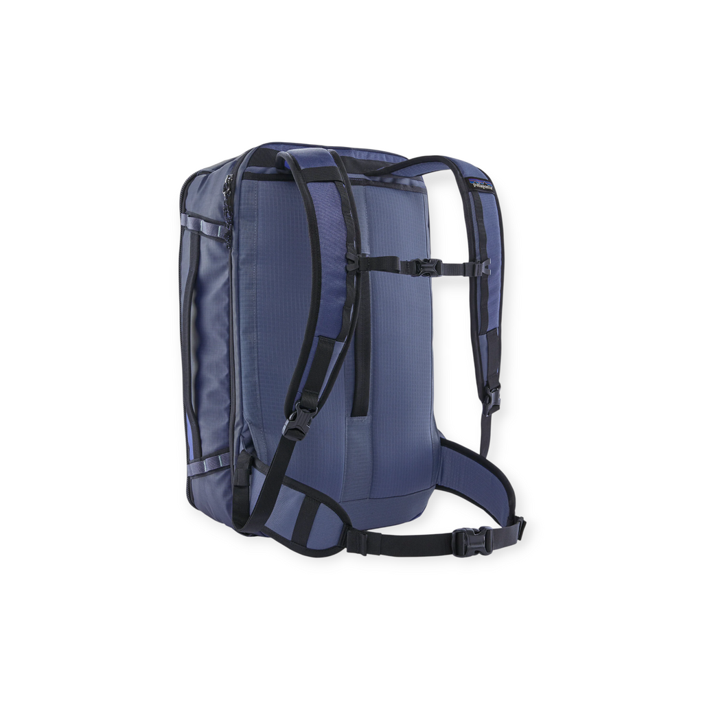 Blue backpack by Patagonia with black straps and buckles, viewed from the back.