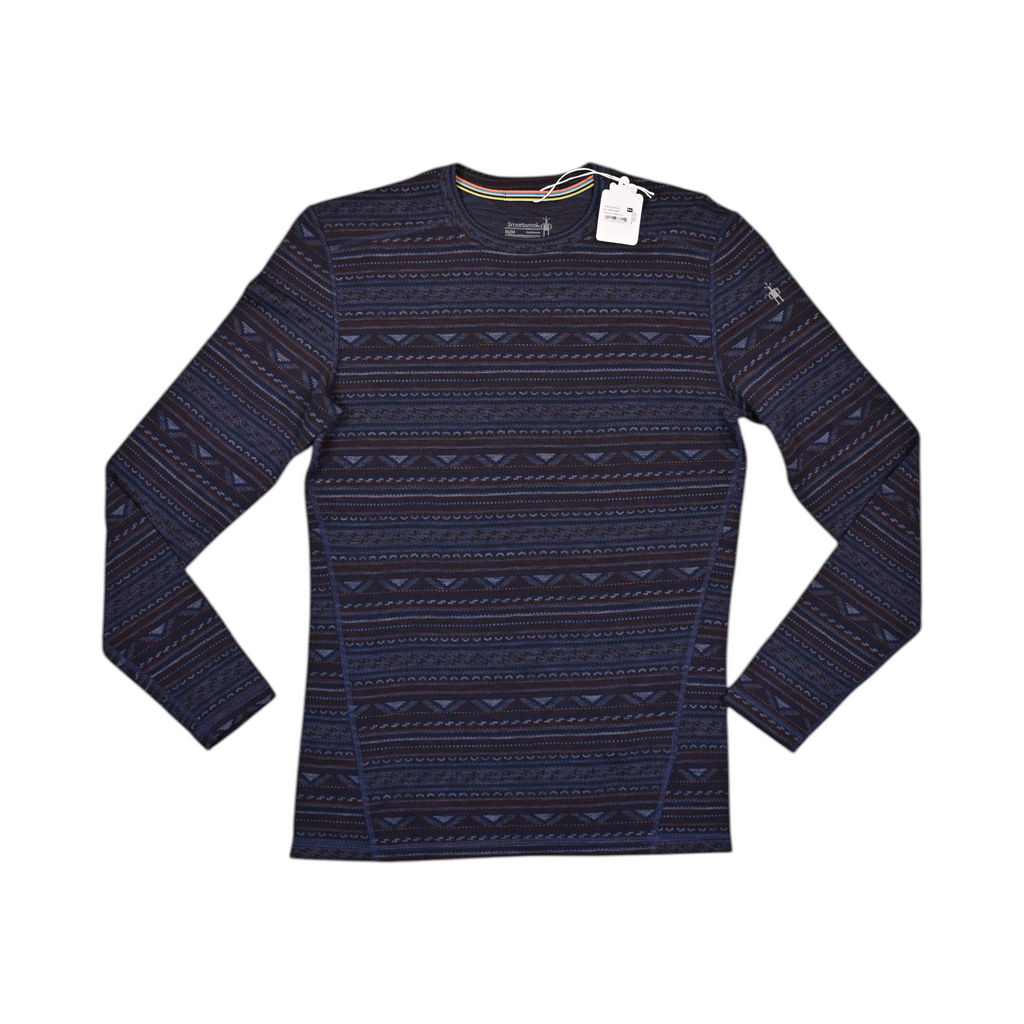 Navy and rust fair-isle patterned crew neck baselayer by Smartwool, laid flat with hangtag attached.