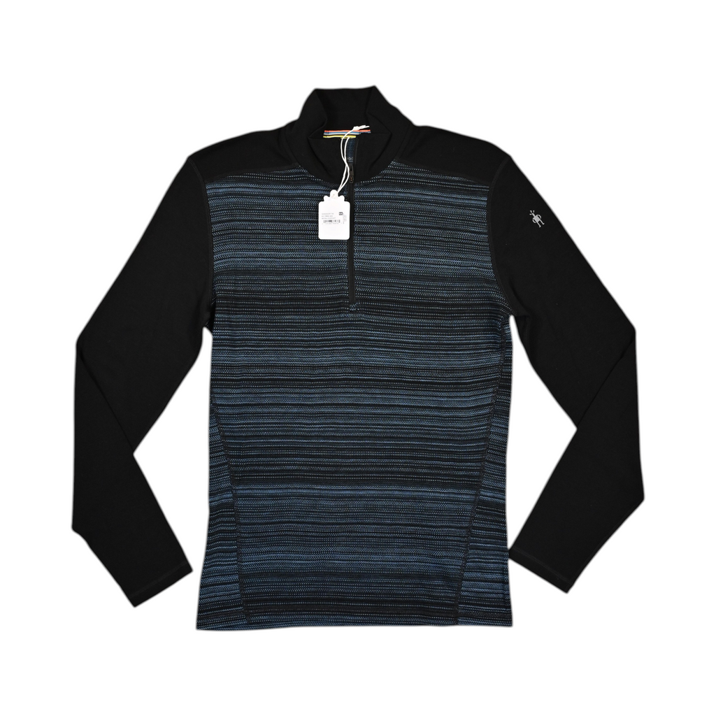Black quarter-zip baselayer by Smartwool with a fine blue striped chest panel, laid flat.