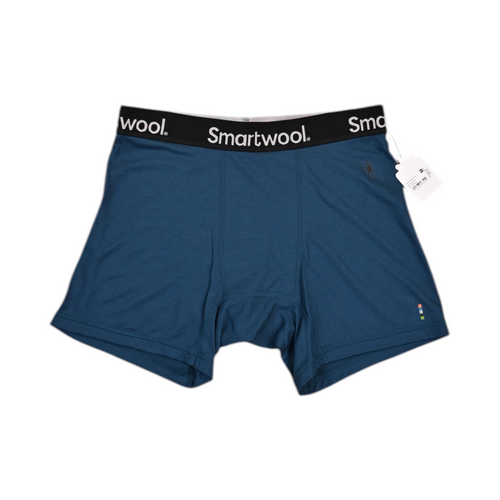 Deep blue Smartwool boxer brief laid flat, showing the waistband and front seam.