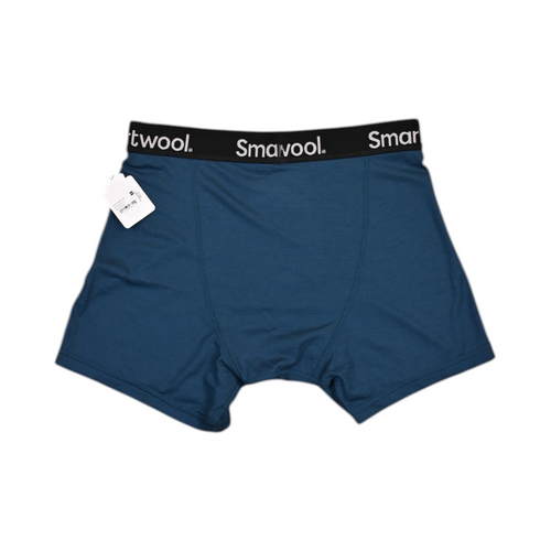 Detail view of a deep blue Smartwool boxer brief showing the waistband logo and stitching.