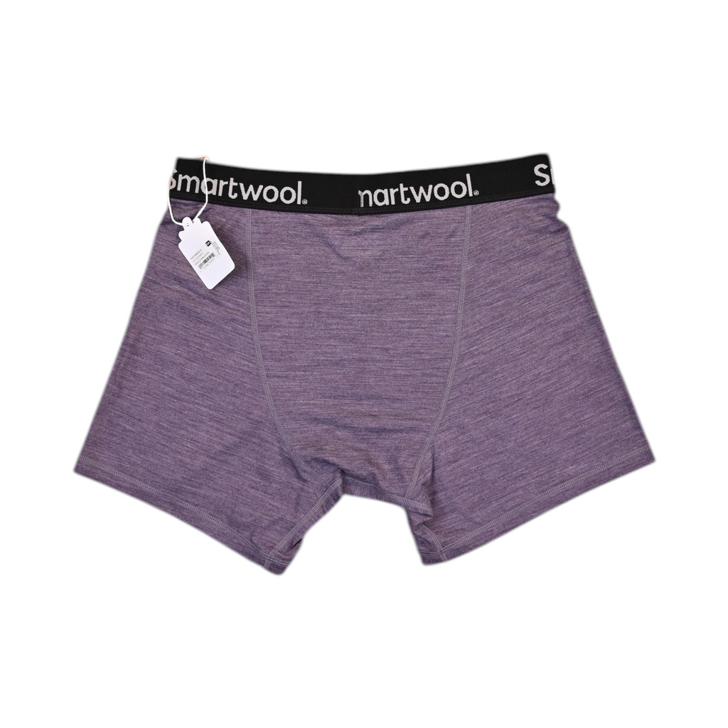 Close view of a purple heather Smartwool boxer brief showing the waistband logo and center seam.