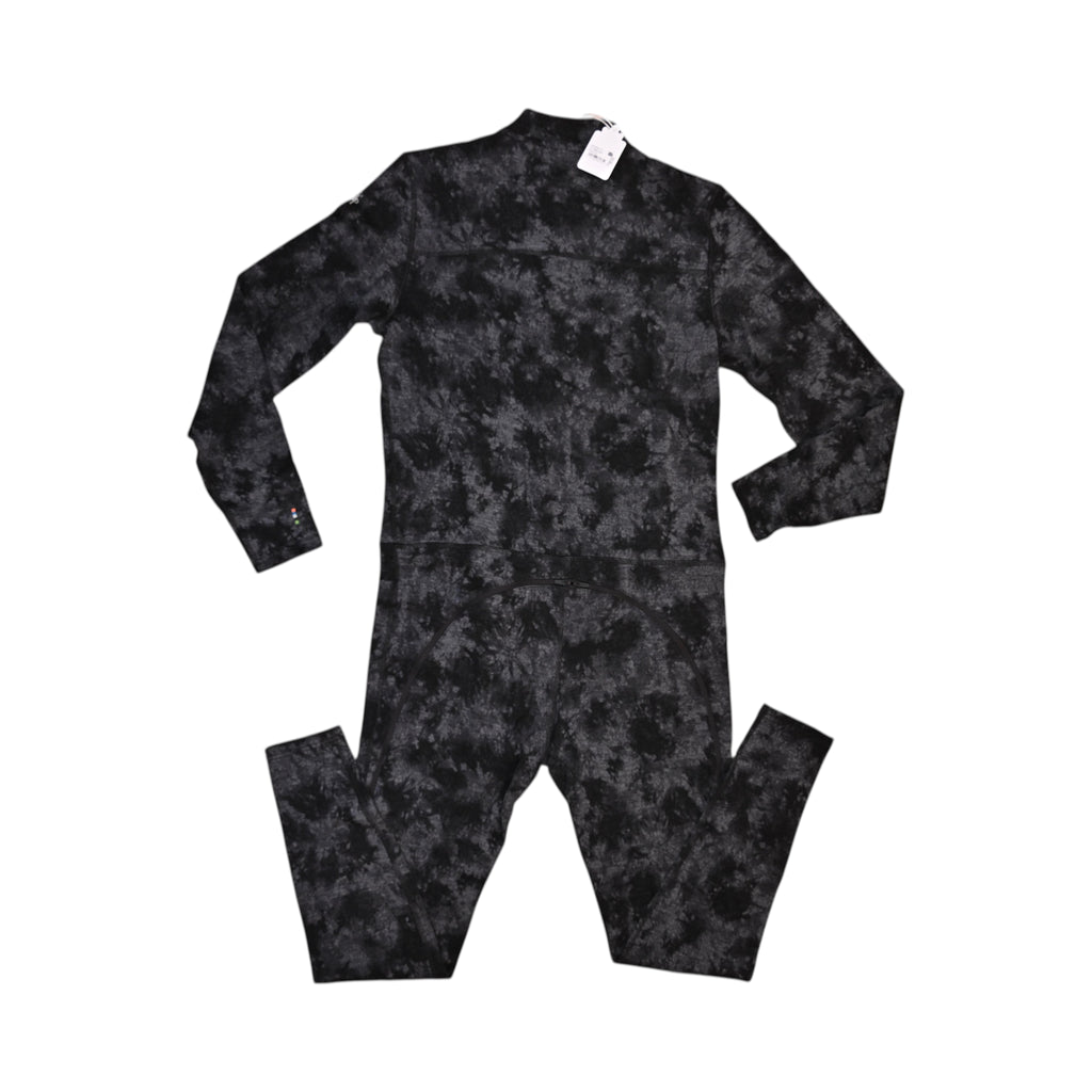 Black tie-dye Merino one-piece base layer by Smartwool, back view showing the zippered drop seat.