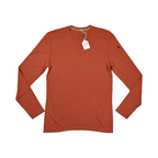 Rust-orange crew neck baselayer by Smartwool, laid flat with hangtag attached.
