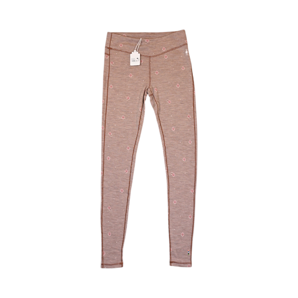Tan floral houndstooth print Smartwool base layer leggings laid flat.