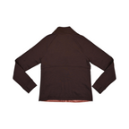 Back of a coral and brown Smartwool hybrid jacket laid flat.