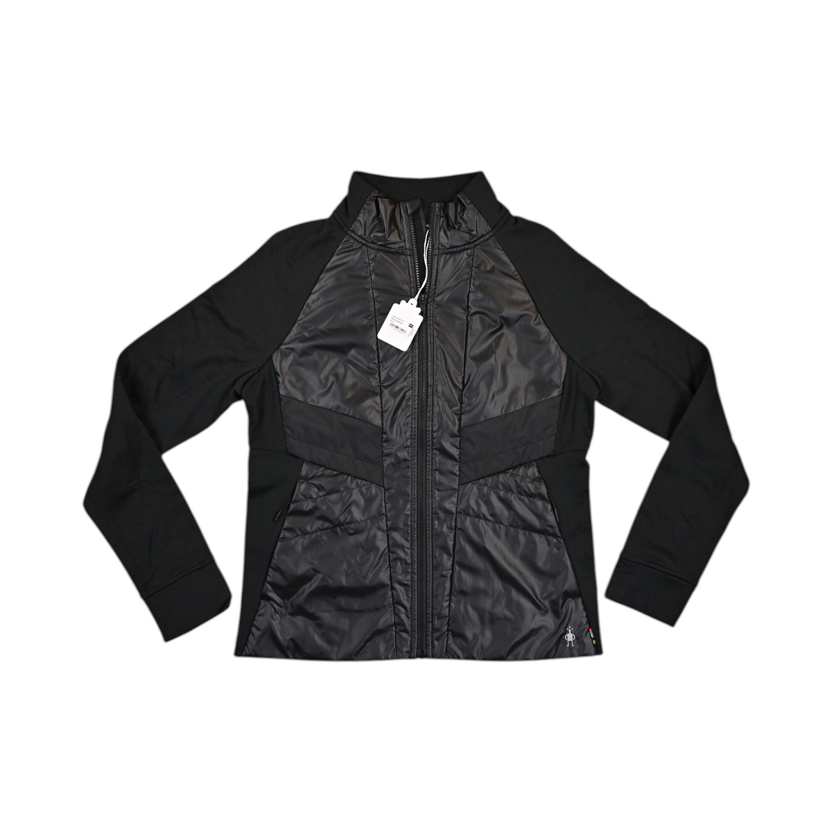 Black Smartwool hybrid jacket laid flat, showing the quilted front panel and fleece sleeves.