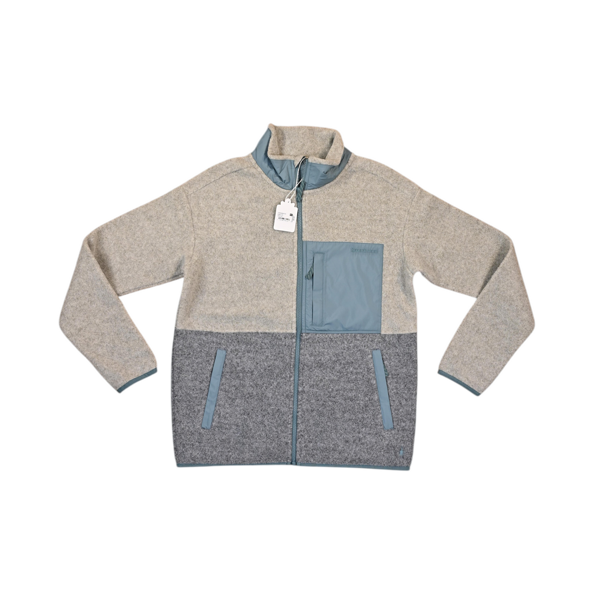 Oatmeal and grey colorblock Smartwool fleece jacket laid flat, showing the teal trim and pocket.