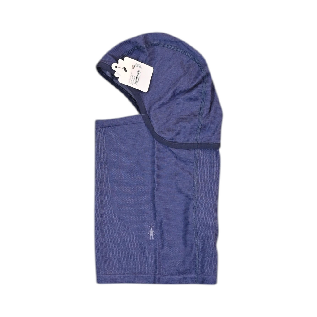 Deep indigo blue Smartwool Intraknit balaclava, side view showing the hood and neck gaiter.