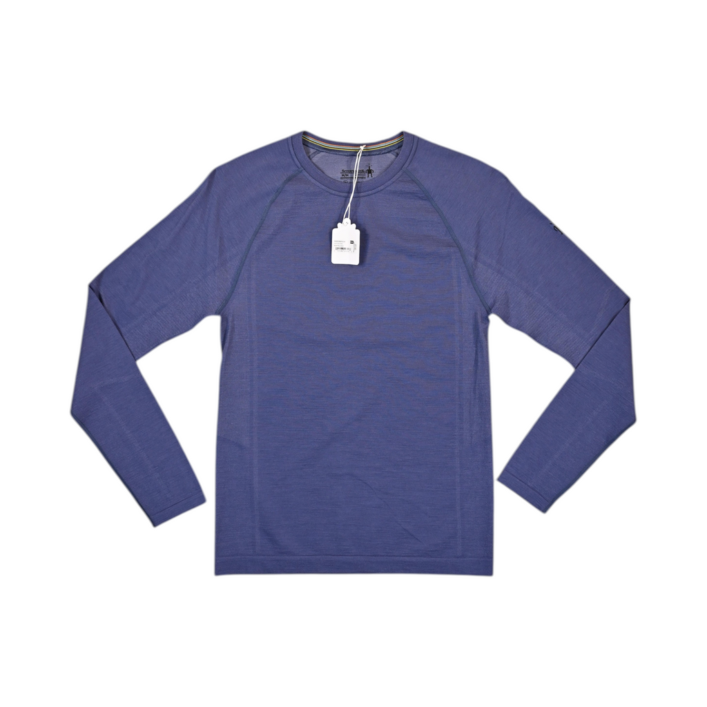Heathered navy blue crew neck baselayer by Smartwool, laid flat with hangtag attached.