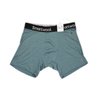 Teal Smartwool boxer brief laid flat, showing the elastic waistband and front seam.
