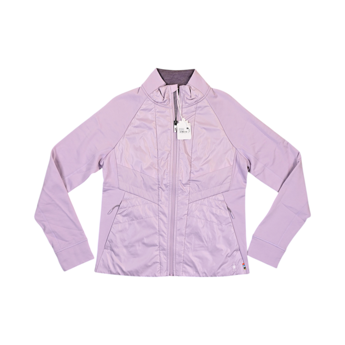 Pale lilac Smartwool hybrid jacket laid flat, showing the quilted front panel and fleece sleeves.
