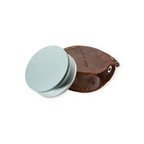 Round grey sharpening stone by Hults Bruk with a brown leather case closed with a snap.