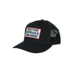 Black trucker hat by FERAL with a patch that reads "Built for Dirtbags & Dreamers".