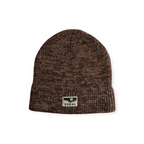 Brown knit beanie by FERAL, featuring a logo patch with a landscape and the brand name.