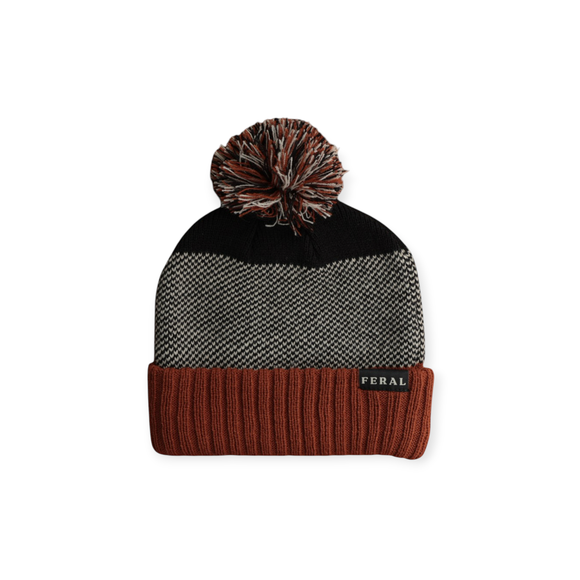 Knit beanie by FERAL, featuring a multi-tone pom-pom, herringbone pattern and ribbed brim.