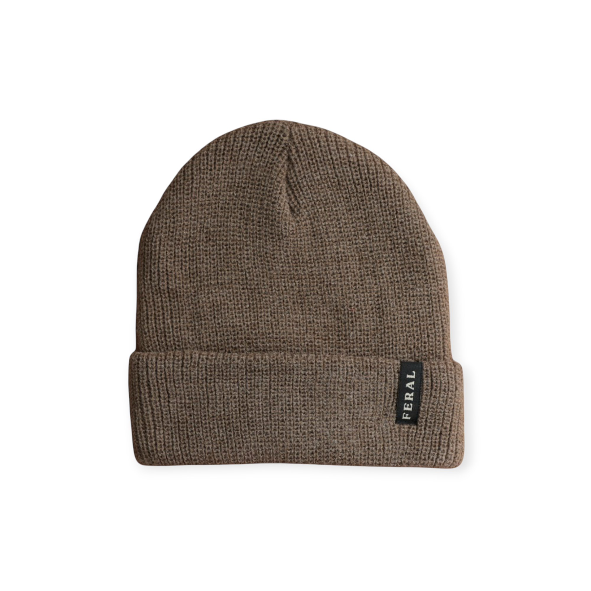 Brown knit beanie by FERAL with a visible rectangular logo tag at the bottom.