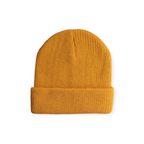 Mustard knit beanie by FERAL, textured with vertical ribbing.