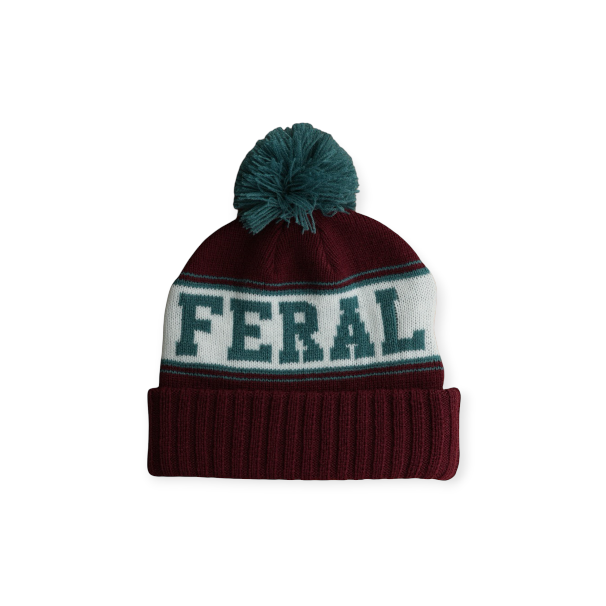 Maroon knit beanie with teal pom by FERAL, featuring a white band with teal lettering.
