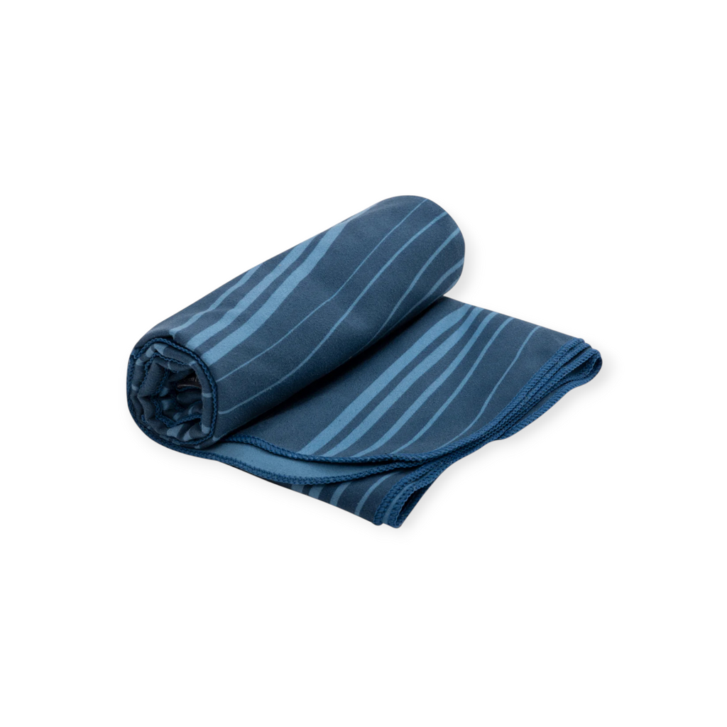 Blue Drylite towel large by Sea to Summit, partially rolled, with lighter blue wavy stripes.