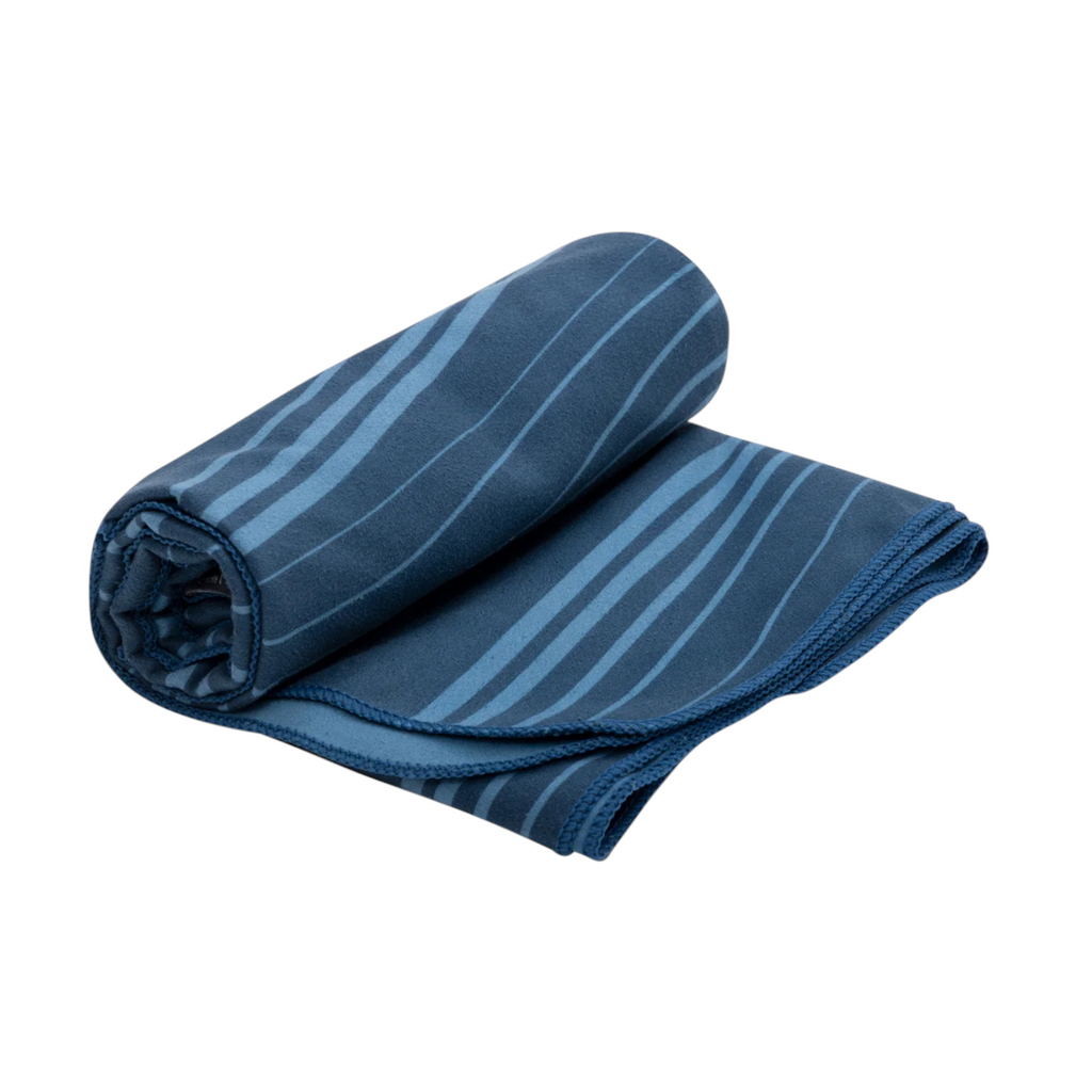 Blue Drylite towel by Sea to Summit, partially rolled up with light blue stripes and a textured hem.