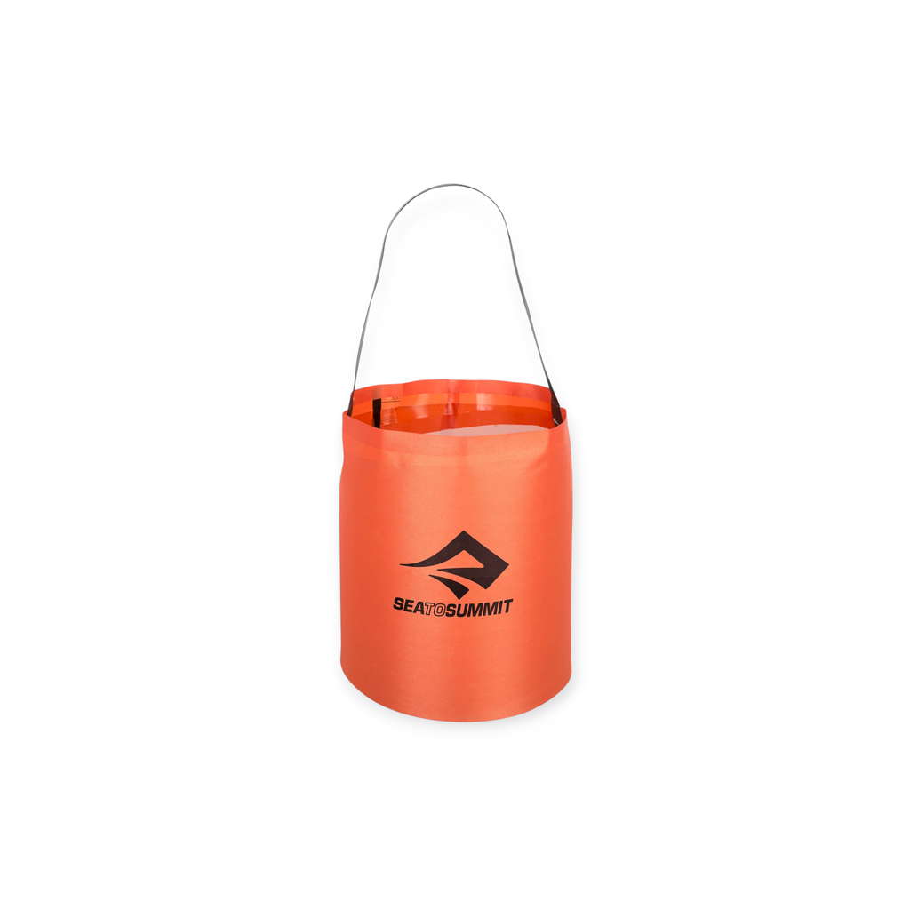 Red 10L nylon folding bucket by Sea to Summit with black carrying strap, shown on a white background.