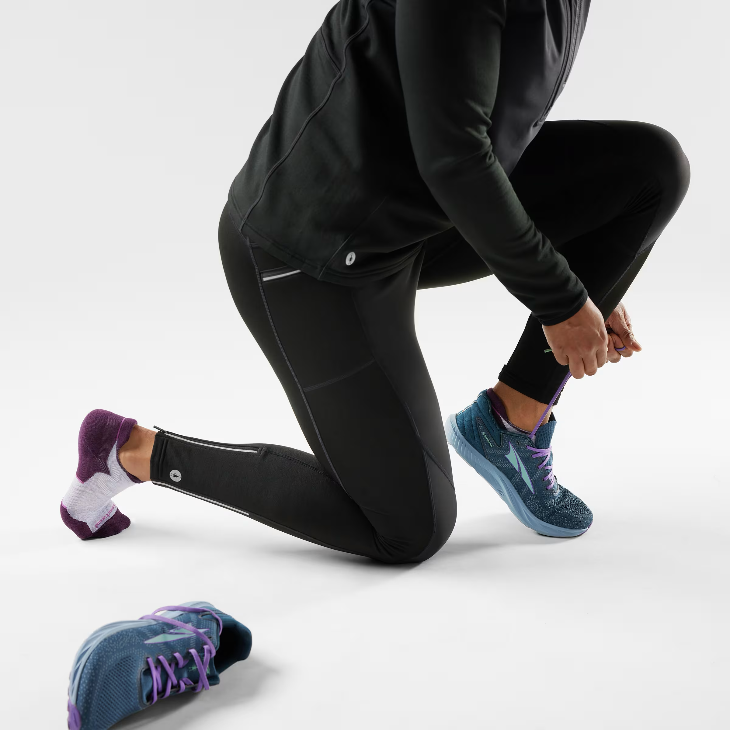 Low ankle socks by Smartwool, with a cushioned sole and purple detailing.