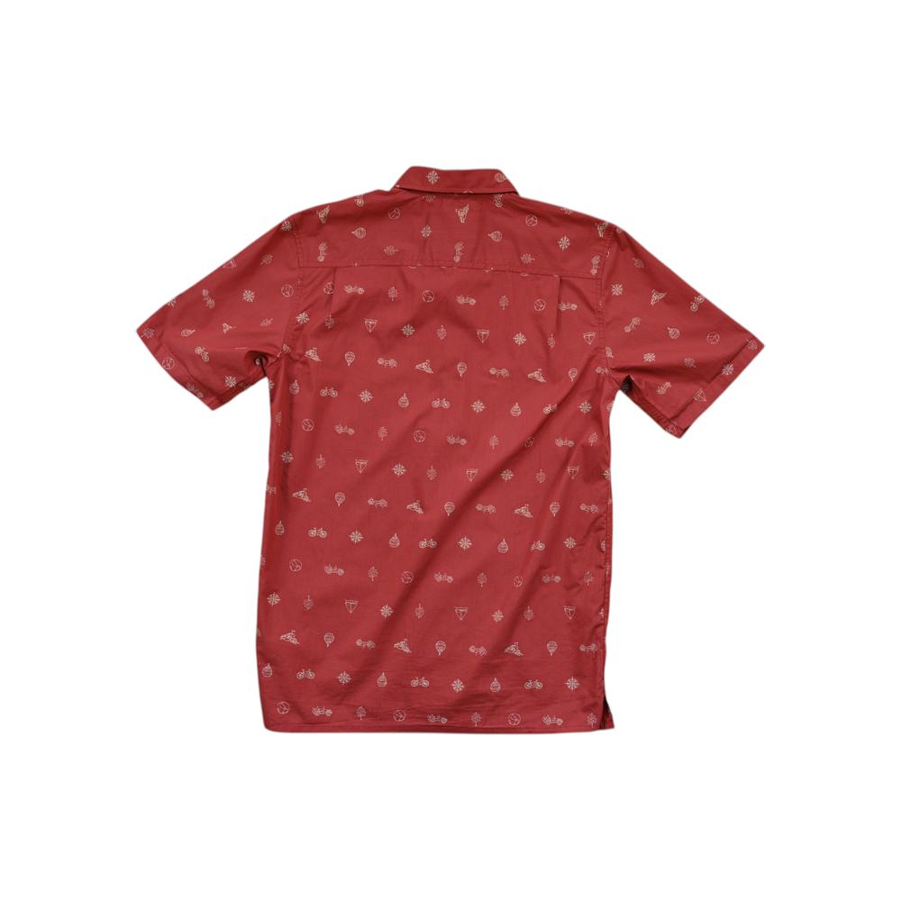 Red button-down shirt by Royal Robbins with an all-over bicycle and snowflake pattern.