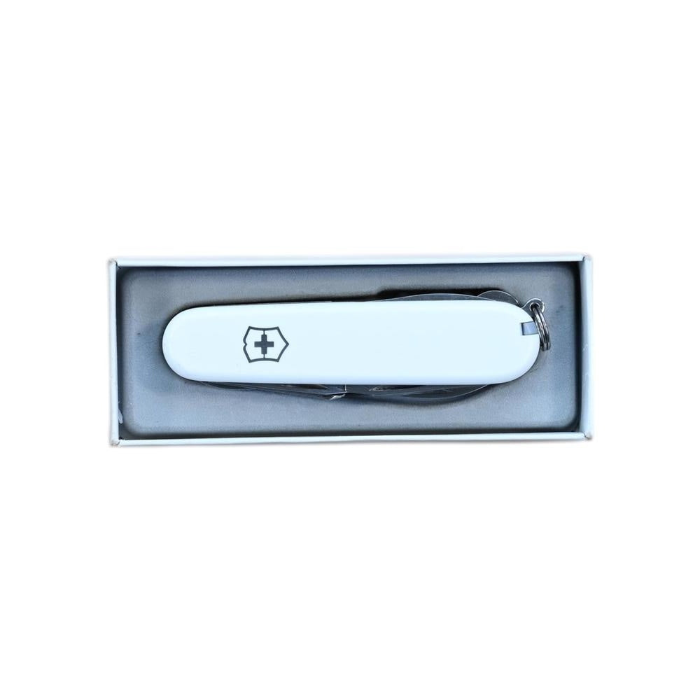 White Swiss Army multi-tool by Victorinox in a box with a silver keyring.