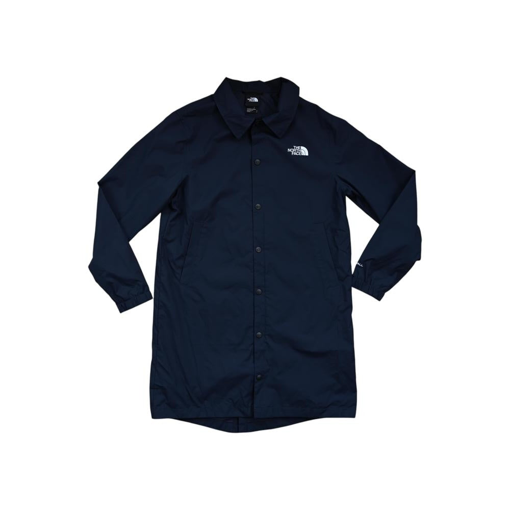 Blue softshell jacket by The North Face with a button-down front and the brand logo on the chest.