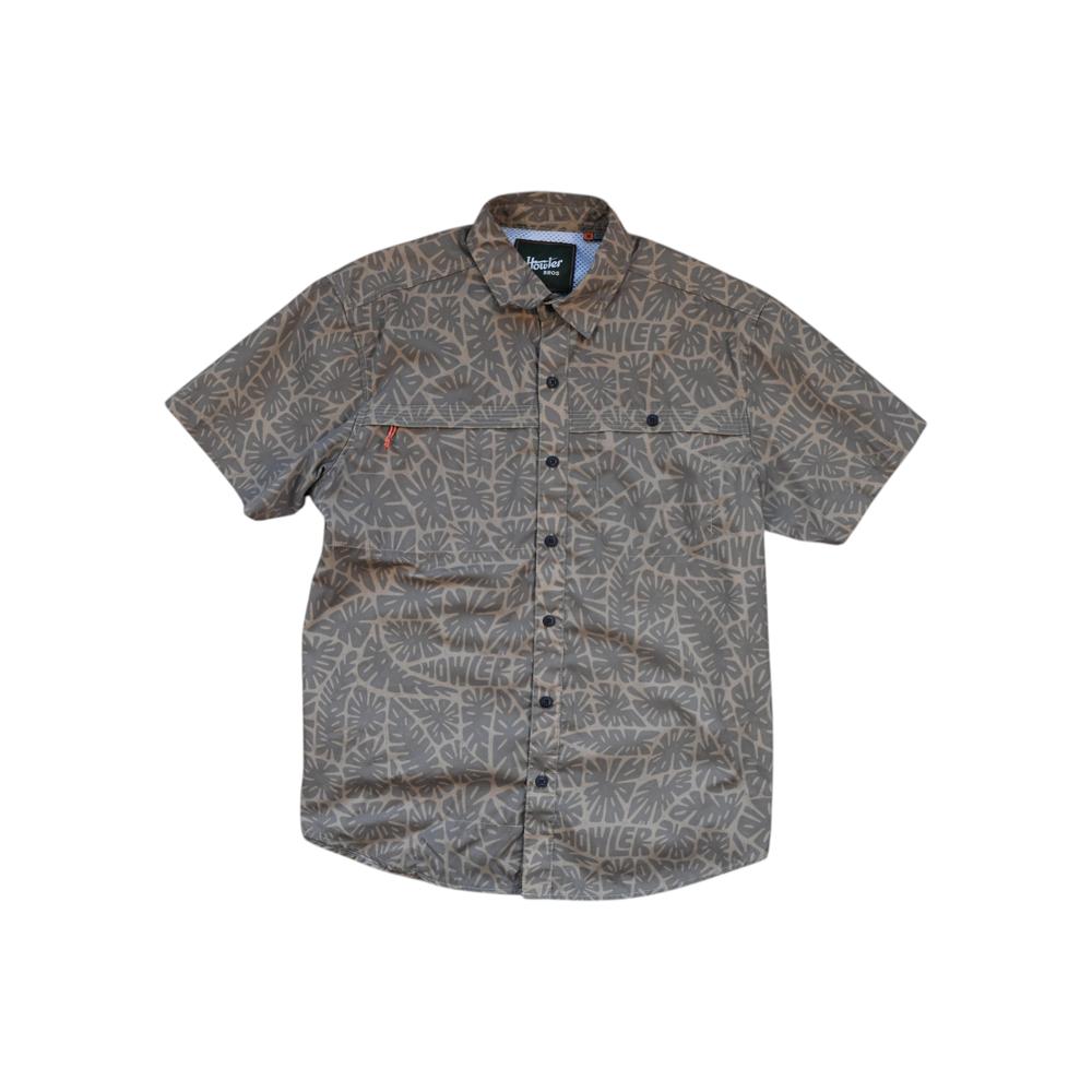 Tan short-sleeve button-up shirt by Howler Bros with an all-over gray tropical foliage pattern