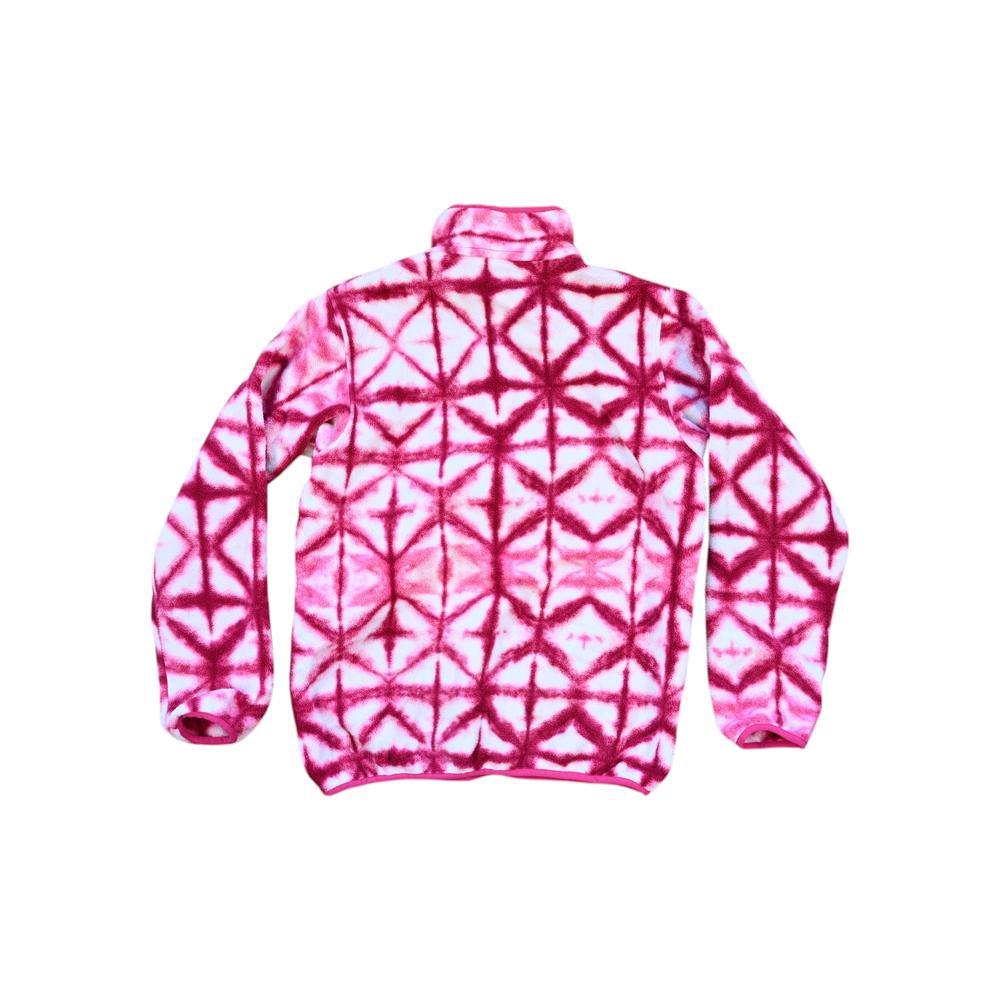 Pink fleece pullover by Patagonia with an all-over diamond tie-dye pattern.