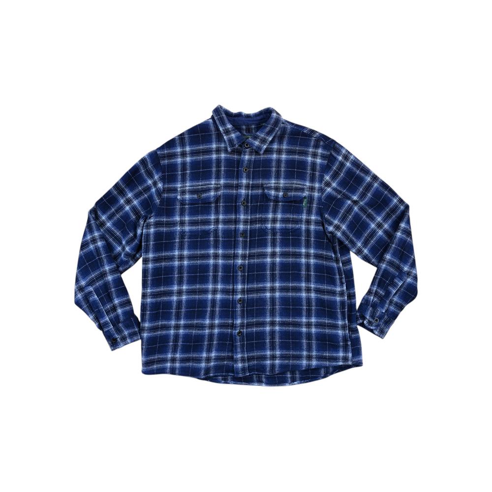 Blue plaid flannel long sleeve shirt by Woolrich featuring a heavyweight weave and button-down front.