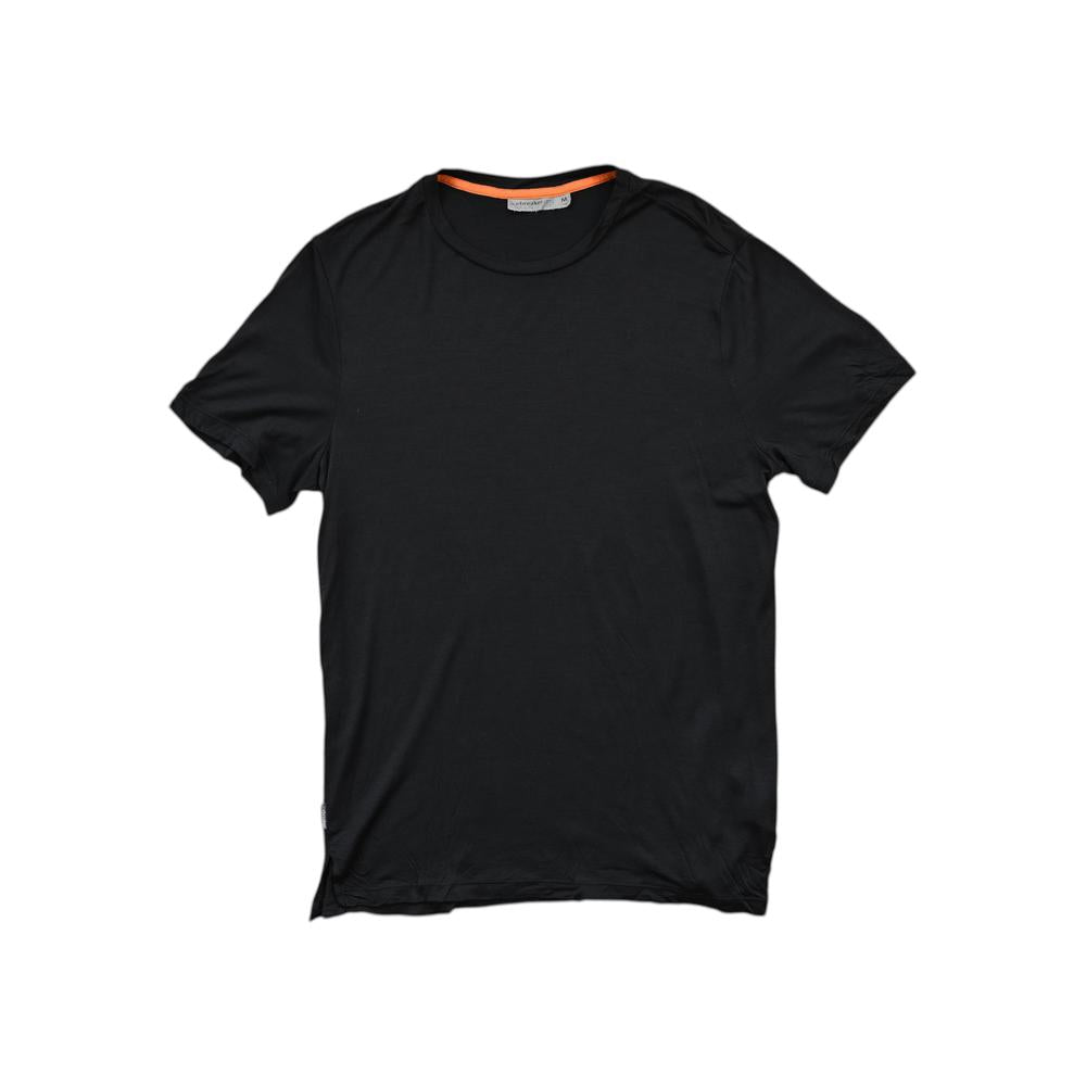 Black t-shirt by Icebreaker with a bright orange collar.