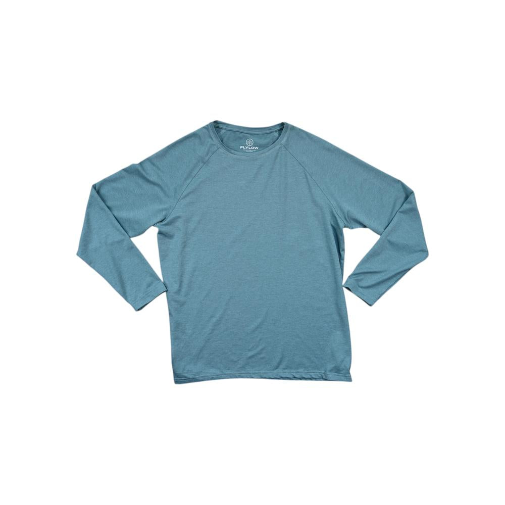 Blue long sleeve baselayer shirt by Flylow, displayed on a white background.