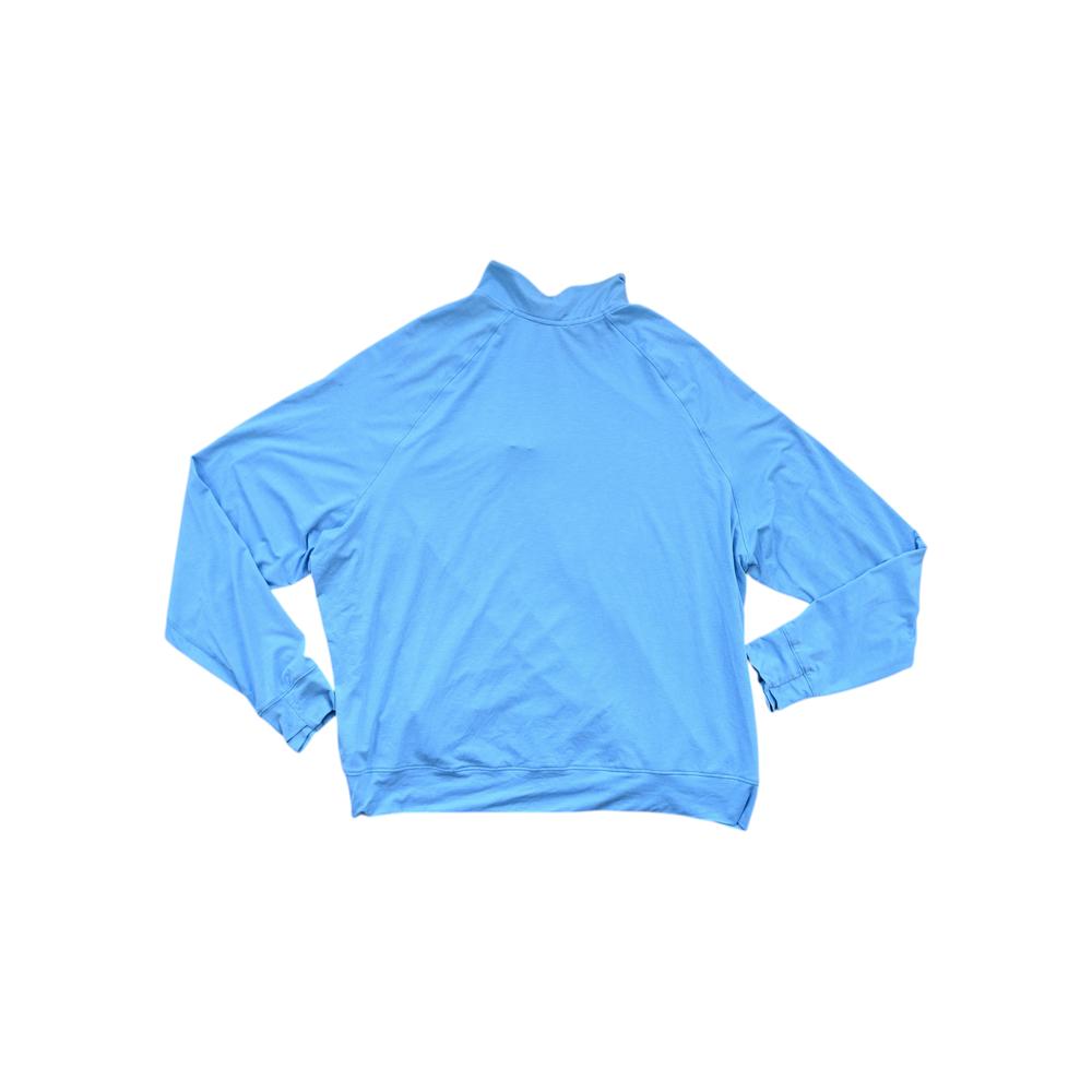 Blue baselayer shirt with quarter zip by REI, shown in a back studio shot.