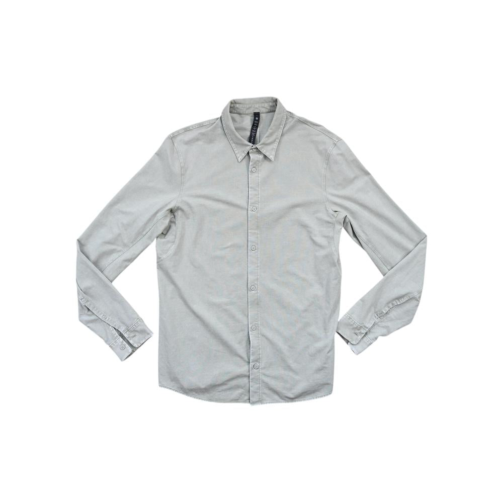 Green long-sleeve button-down shirt by Lululemon, displayed on a white background.