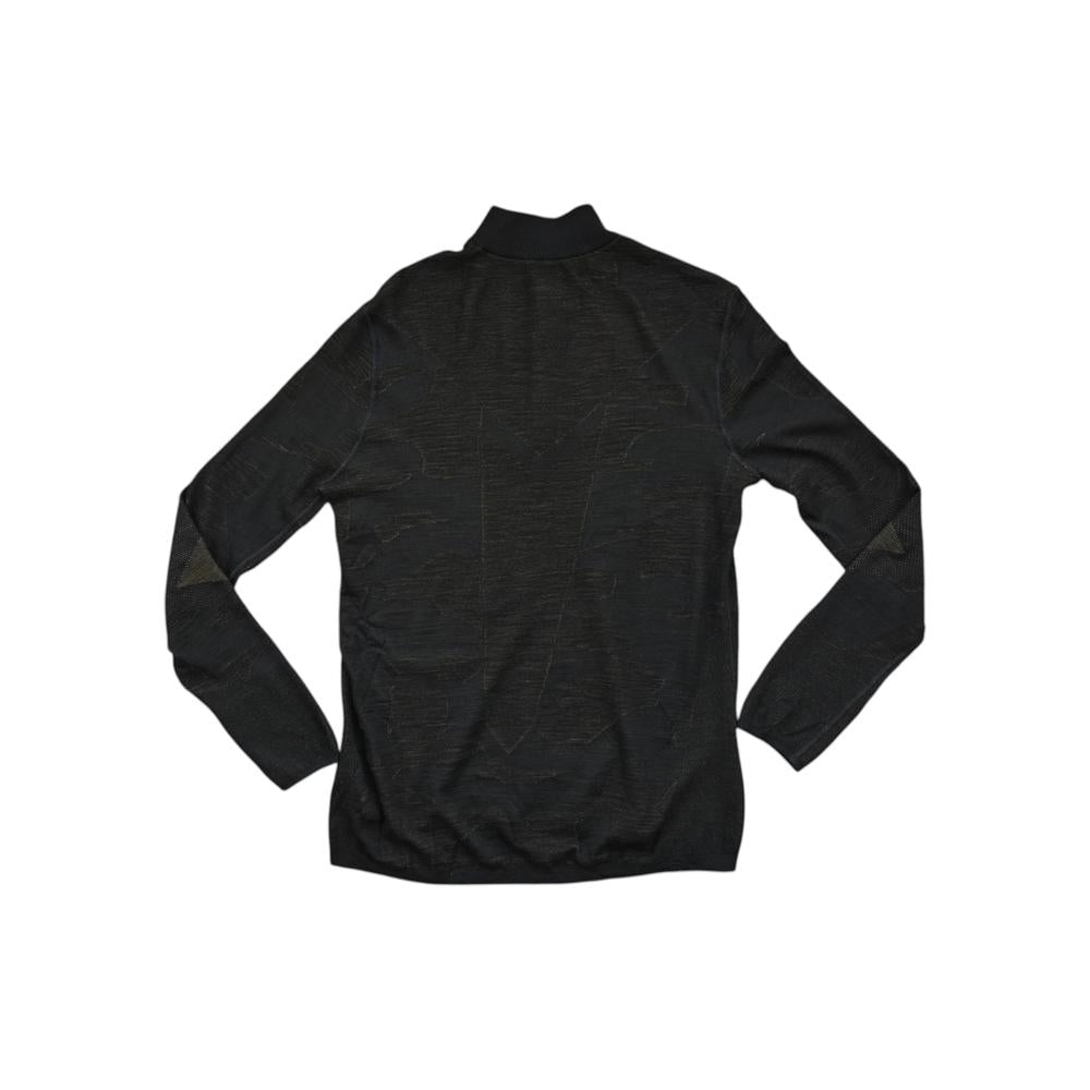 Black baselayer shirt in merino wool by Smartwool, shown in back view with long sleeves.