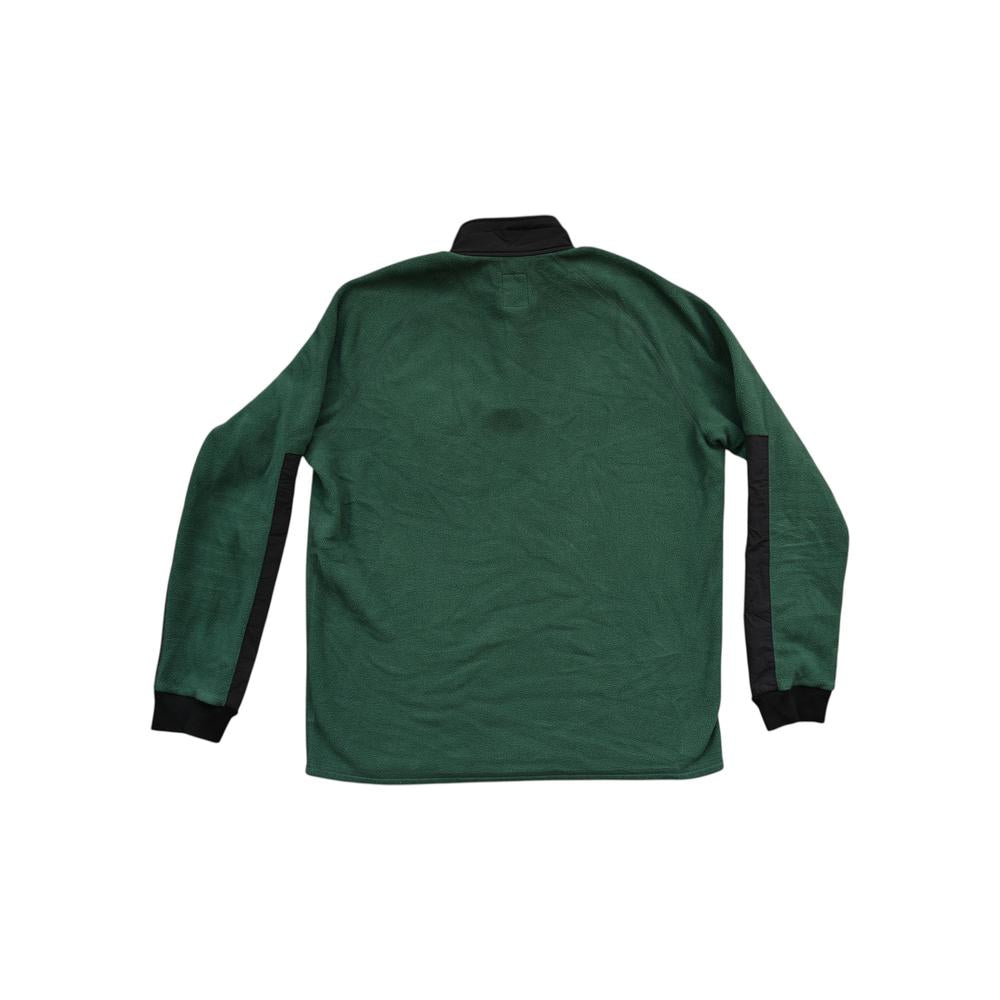 Green fleece pullover by Topo Designs with black accents on the sleeves and collar, shown from the back.