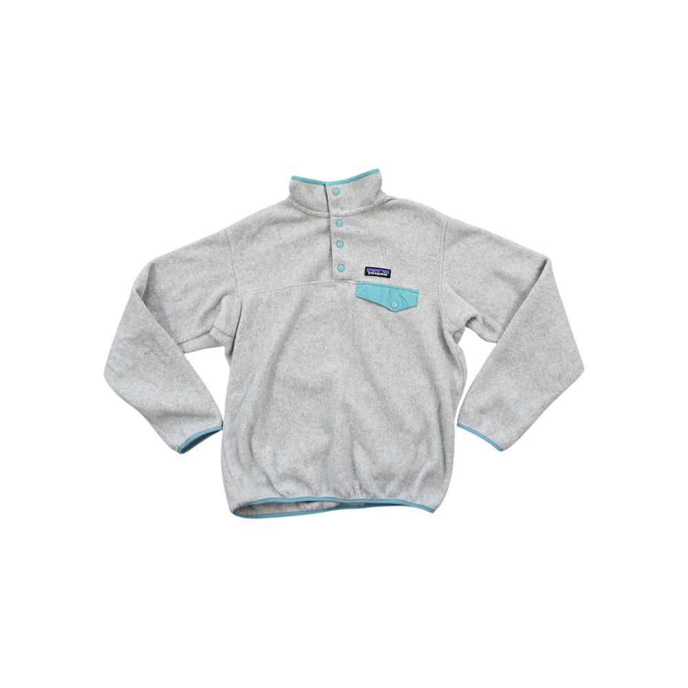 Gray fleece pullover by Patagonia with snap placket and blue trim on the collar, pocket, and hem.