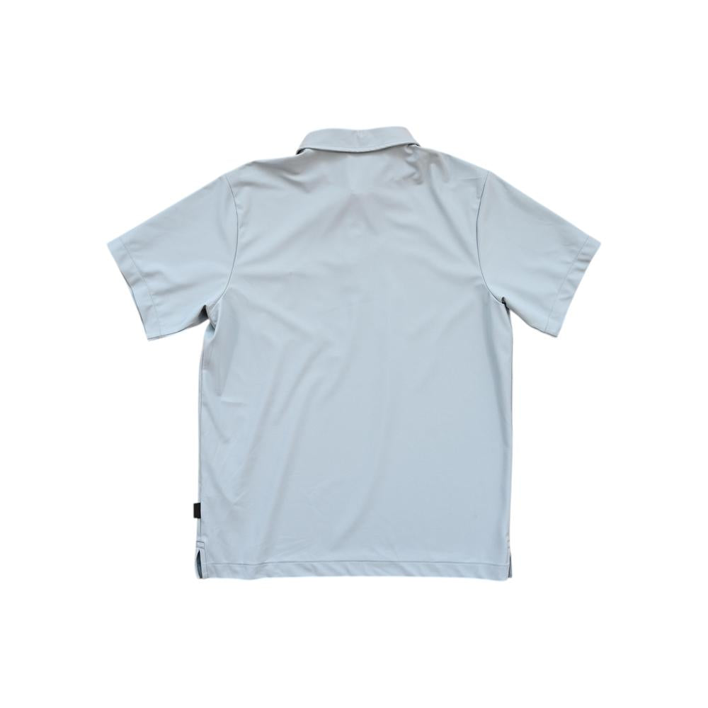 Blue polo shirt by Patagonia, presented from the back.