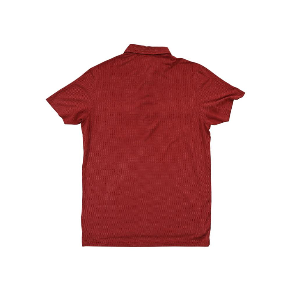 Red polo shirt by Kuhl, featuring short sleeves and a classic collar, shown from the back.