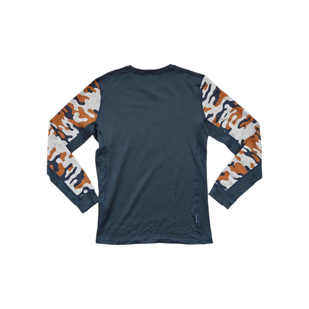 Navy and orange baselayer shirt for women by Kari Traa, featuring a camo patterned sleeve.