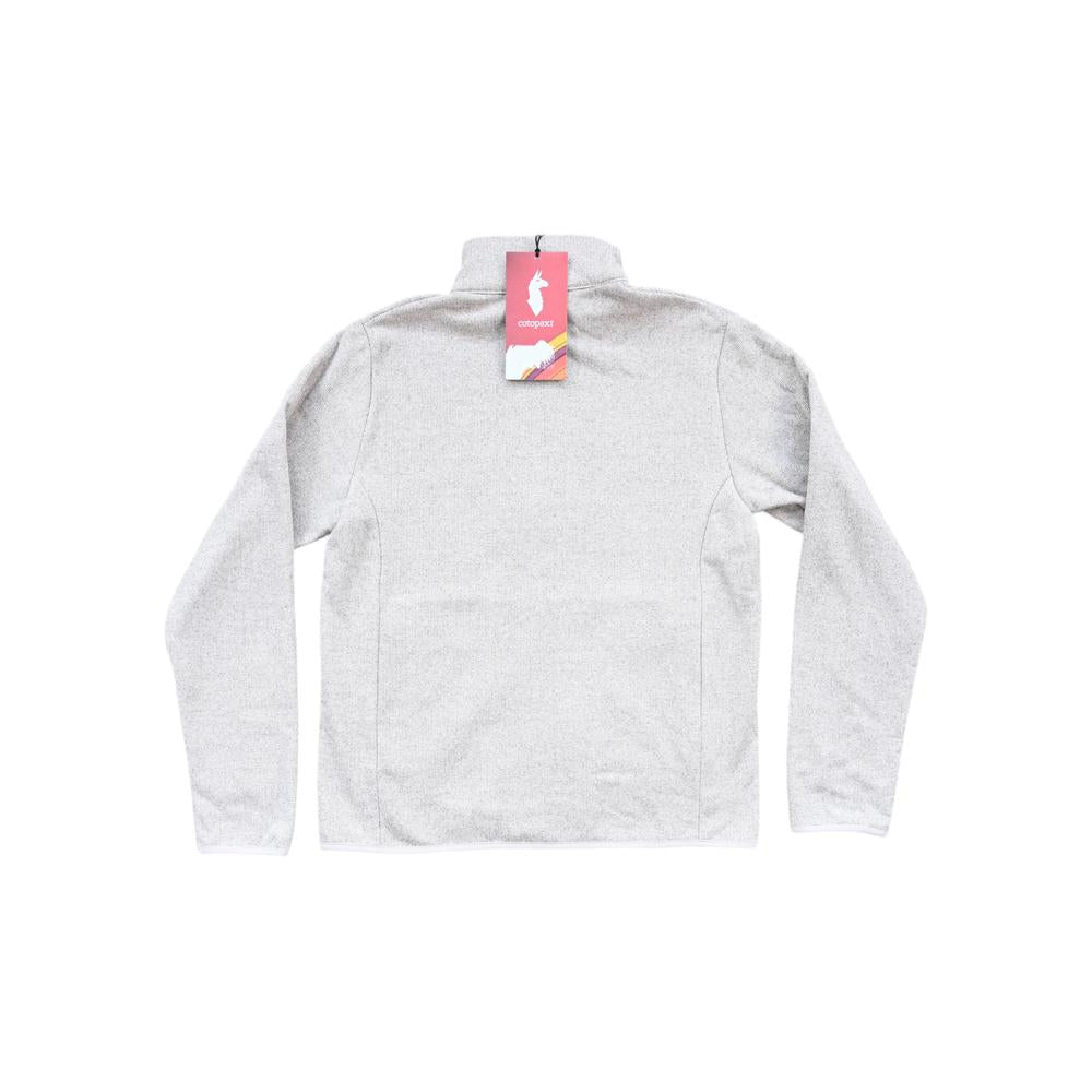 White fleece jacket for women by Cotopaxi with a full zipper and a tag visible.