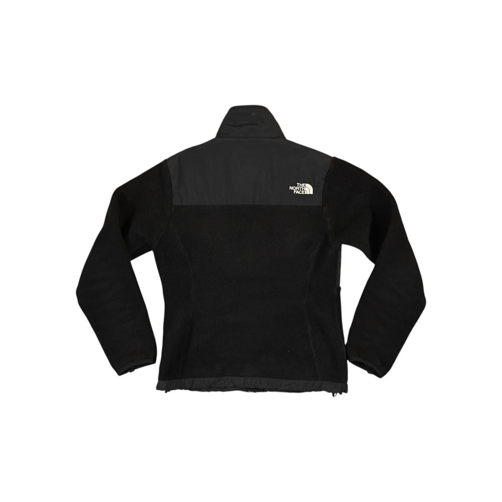 Black fleece jacket by North Face, with a smooth black panel across the upper chest and shoulders.